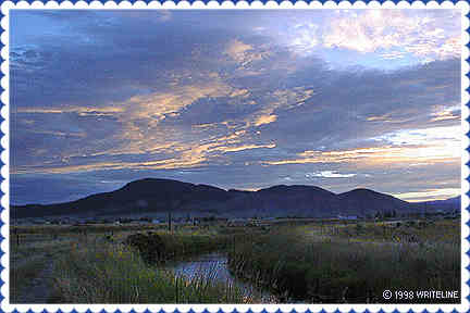 All images Copyright © 1997 - 2000 WriteLine. All Rights Reserved. Setting Sun over mountains